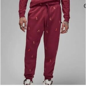 Nike Air Jordan MJ Essentials All-Over Print Pants Cherrywood Red colorway